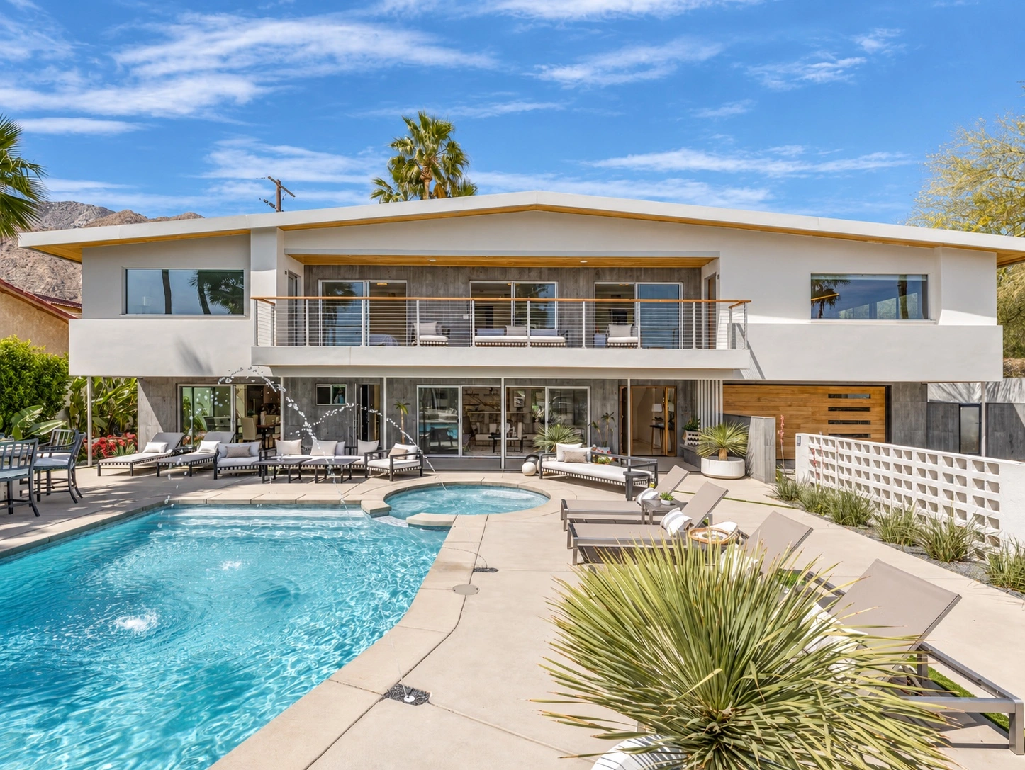 Milo House’s two-story exterior and balcony overlooking its private pool and spa