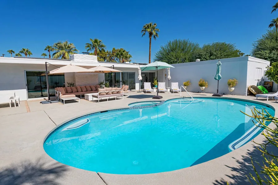 The curved pool and private garden at Rancho Amado